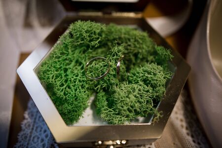 wooden box for wedding rings with bouquetの写真素材