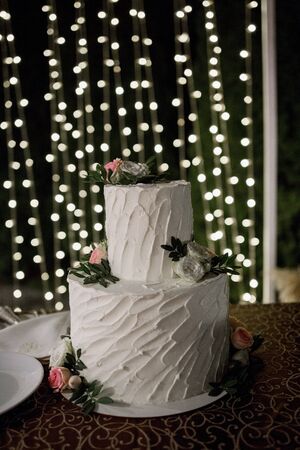 large white wedding cake in eveningの写真素材