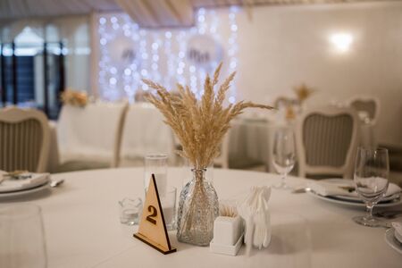 decor of flowers at a wedding in banquet hallの写真素材