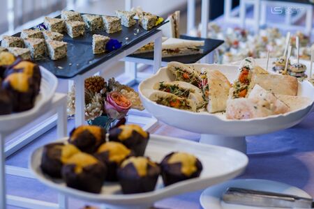 food and snacks on the buffet table in restaurantの写真素材