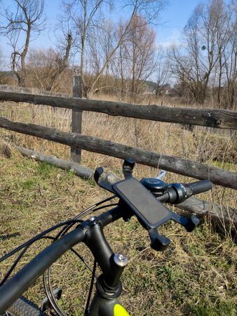 bike near the old fence in villageの写真素材