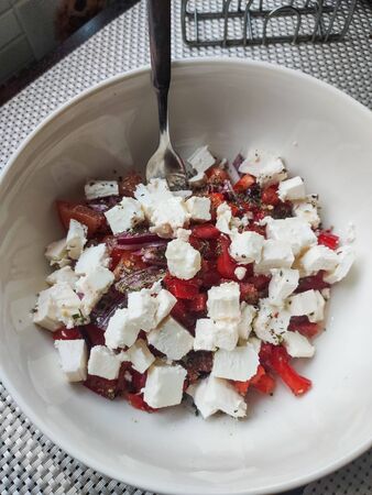 vegetable salad with feta in plateの写真素材
