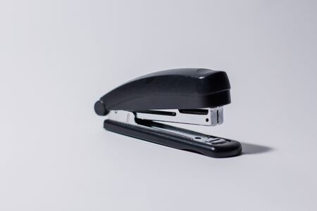 black stapler on white backgroundの写真素材