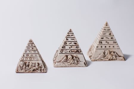 figurines of egyptian pyramids souvenir on whiteの写真素材