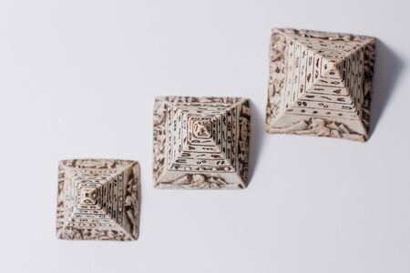 figurines of egyptian pyramids souvenir on whiteの写真素材