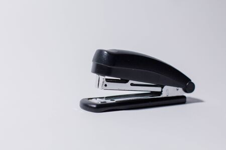 black stapler on white backgroundの写真素材