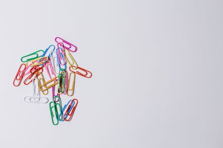 multicolored paper clips on white backgroundの写真素材