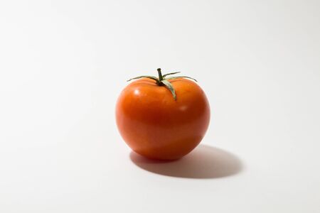 ripe tomato on white backgroundの写真素材