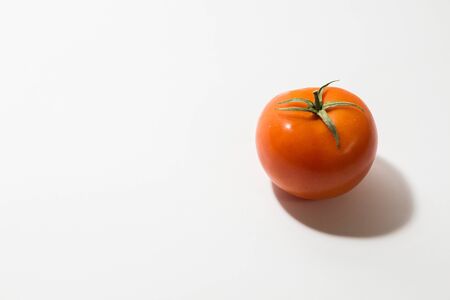 ripe tomato on white backgroundの写真素材