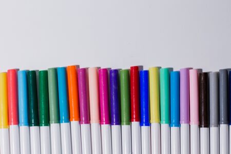multicolored felt-tip pens on white backgroundの写真素材