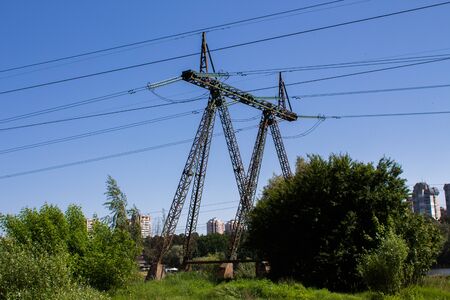high voltage power lines in forestの写真素材