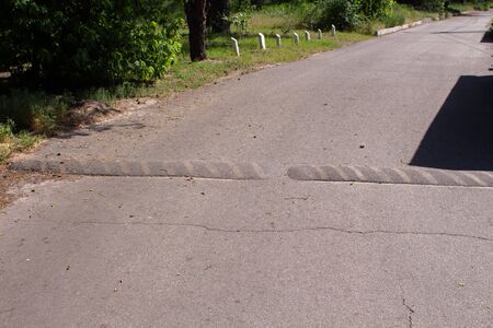 a speed bump on the pavementの写真素材