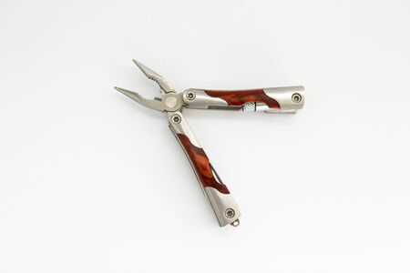 multitool set with knife and opener on background