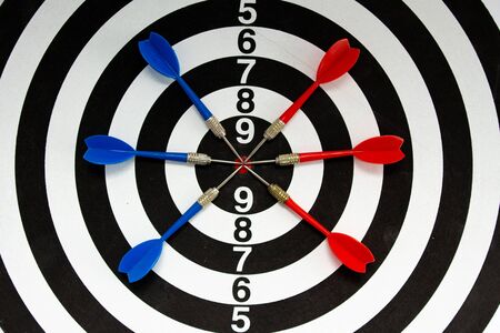 a darts game with blue and red dartsの写真素材