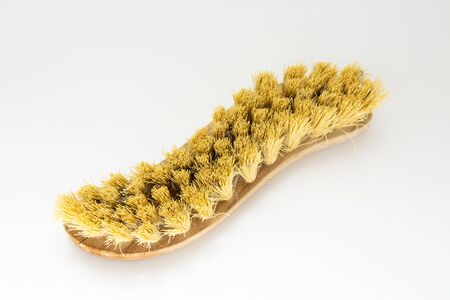 wooden cleaning brush on white backgroundの写真素材