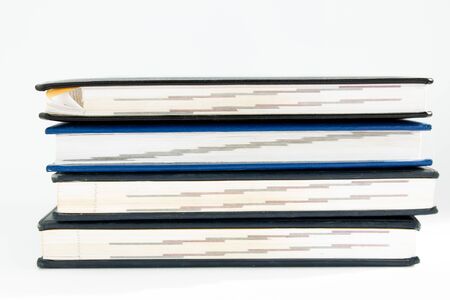 a stack of old books on white backgroundの写真素材