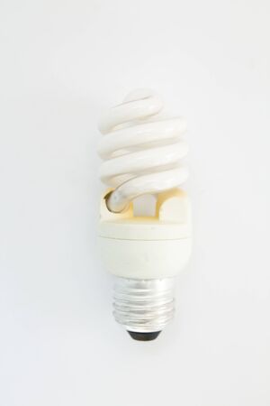 old spiral light bulb on white backgroundの写真素材