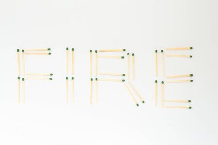 inscription fire from matches white backgroundの写真素材