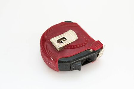 red construction tape measure white backgroundの写真素材