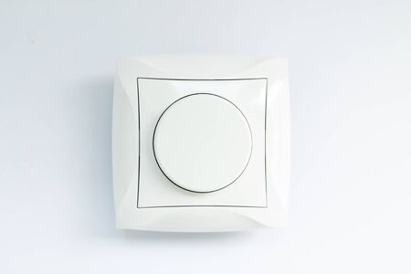 round light switch on white background