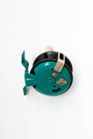 a fishing reel on white backgroundの写真素材