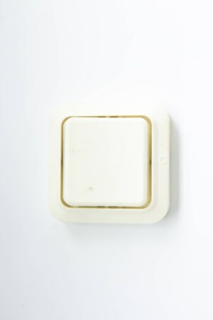 old light switch on white backgroundの写真素材