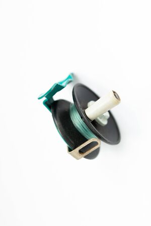 a fishing reel on white backgroundの写真素材