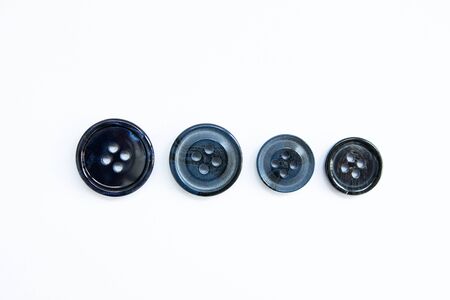 black buttons for clothes on white backgroundの写真素材