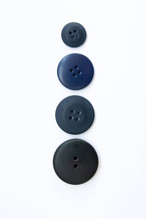 black buttons for clothes on white backgroundの写真素材