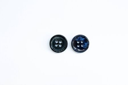 black buttons for clothes on white backgroundの写真素材
