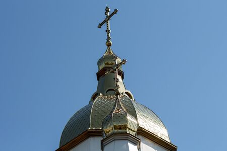 golden domes of the church against blue skyの写真素材