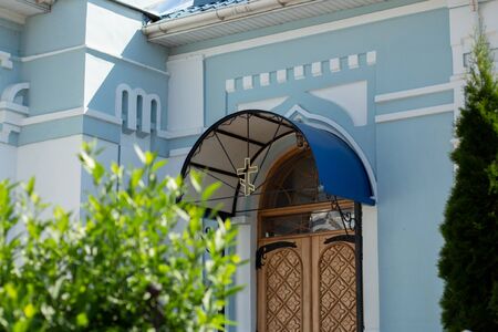 a beautiful church door with crossの写真素材