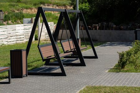 a new swing bench in the parkの写真素材