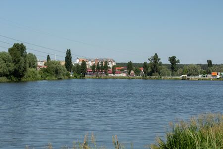 private houses over lake in the forestの写真素材