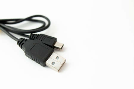 black usb cable on white backgroundの写真素材