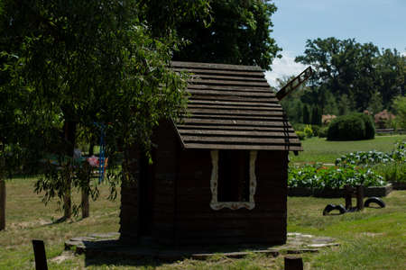small wooden house with millの写真素材