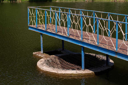 an iron pier over the lakeの写真素材