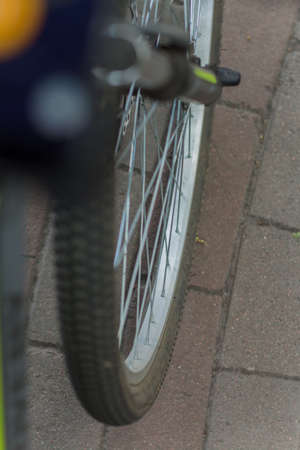 bicycle wheel on asphalt in the park