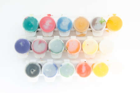 jars with gouache paints on white backgroundの写真素材