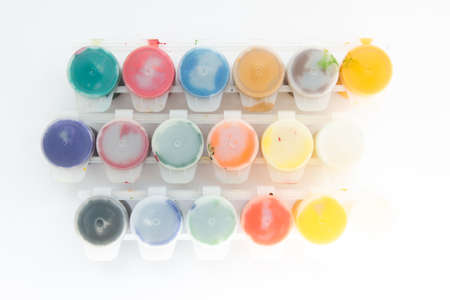 jars with gouache paints on white backgroundの写真素材
