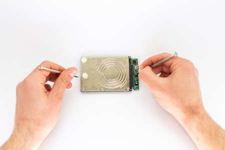 a man repairs hard drive