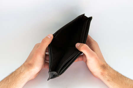empty wallet in hands on white backgroundの写真素材