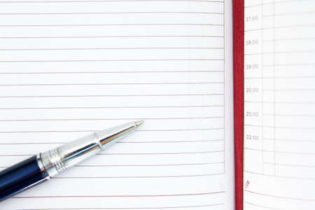 a pen on a piece of paperの写真素材