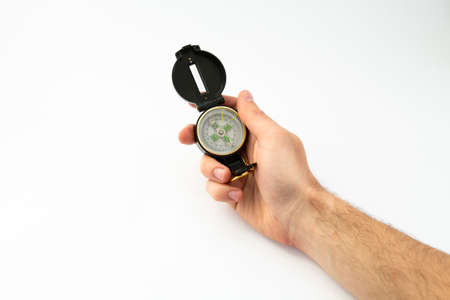 compass in hand on white backgroundの写真素材