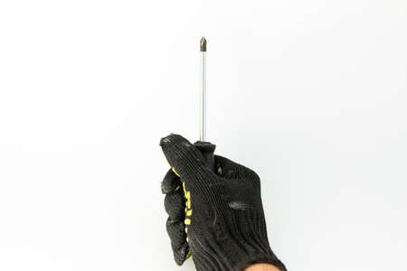 screwdriver in builder's hand on white backgroundの写真素材