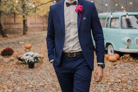 groom at the wedding in suit in the parkの写真素材