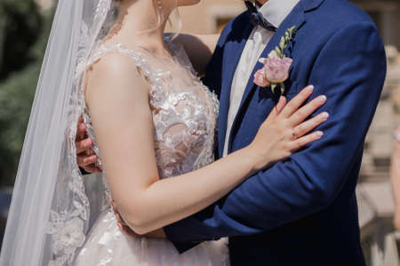 a groom with bride together in summer park