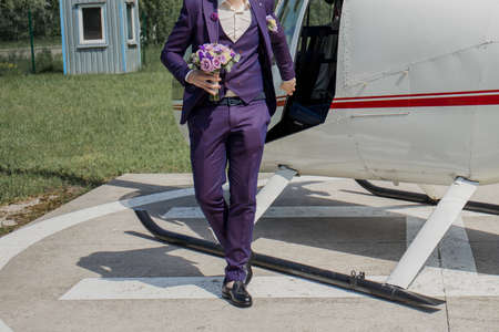 the groom with the bride near the helicopterの写真素材
