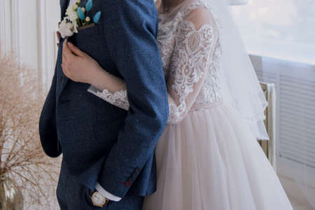 a groom with bride in studio together at weddingの写真素材