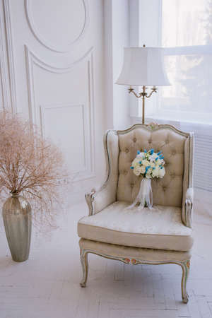 bridal bouquet on chair in the studioの写真素材